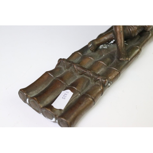 150 - Chinese bronze figure of a fisherman on a bamboo raft, with rod in hand, measures approx 28cm long