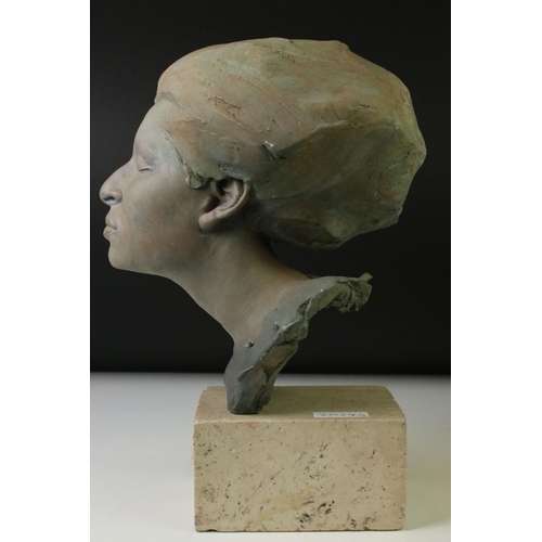 153 - Patinated bust of a woman with her eyes closed, signed Philip Wakeham and dated '94, on a polished s... 