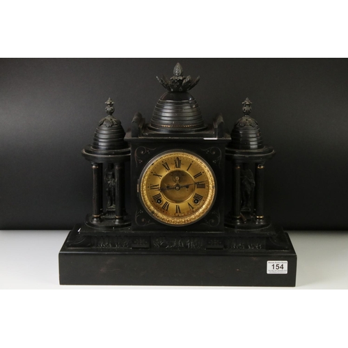 154 - 19th Century slate mantle clock with Roman numerals on a brass dial, flanked by two four-column arch... 