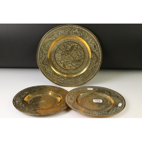158 - Set of three Chinese brass plates with engraved dragon and Greek key-style decoration, comprising a ... 