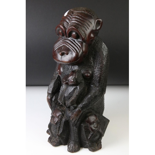 162 - African carved hardwood stylised figure of a family group of monkeys, comprising the mother with a c... 