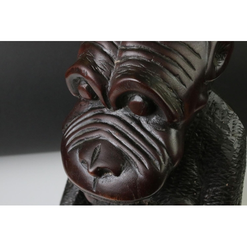 162 - African carved hardwood stylised figure of a family group of monkeys, comprising the mother with a c... 
