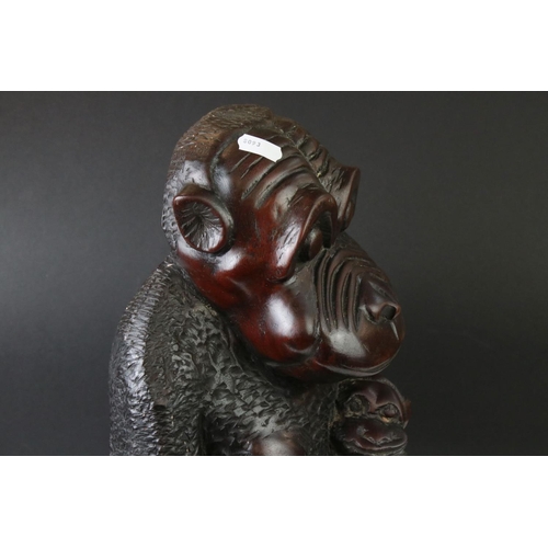162 - African carved hardwood stylised figure of a family group of monkeys, comprising the mother with a c... 