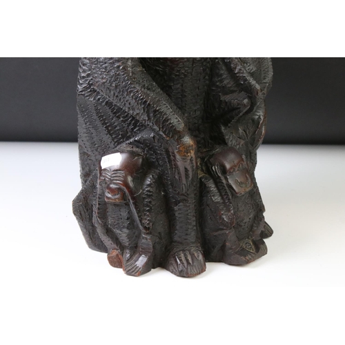 162 - African carved hardwood stylised figure of a family group of monkeys, comprising the mother with a c... 