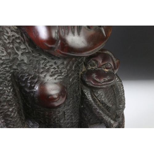 162 - African carved hardwood stylised figure of a family group of monkeys, comprising the mother with a c... 