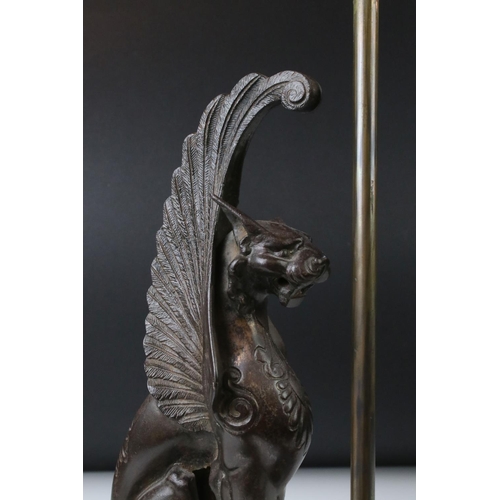 163 - 19th century cast iron model of a winged lion, left ear missing, height approx. 32cm, mounted as a t... 