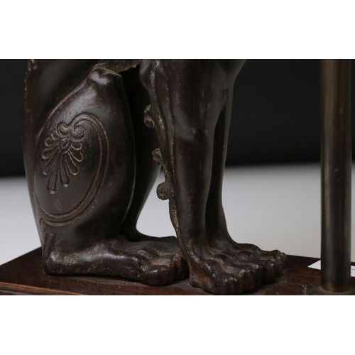 163 - 19th century cast iron model of a winged lion, left ear missing, height approx. 32cm, mounted as a t... 