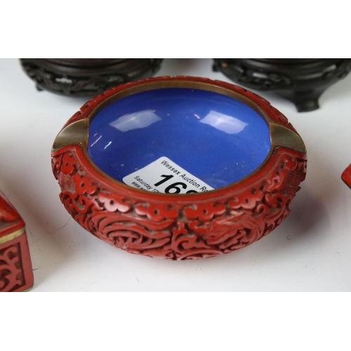 168 - Five pieces of 20th century Chinese cinnabar lacquer ware comprising a pair of baluster vases depict... 