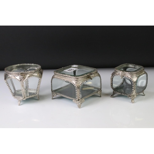 169 - Three glass and metal jewellery caskets