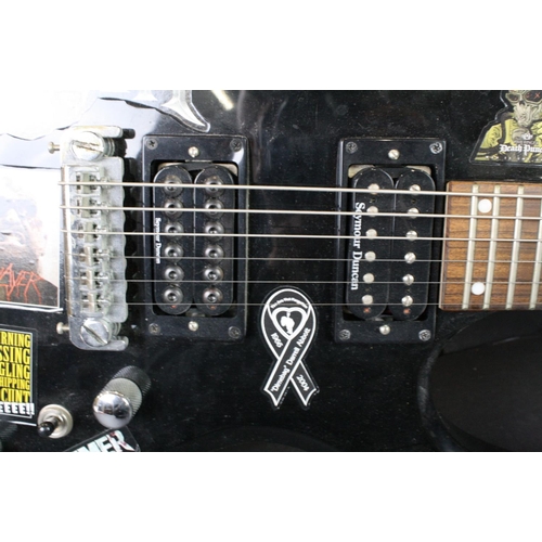 843 - Guitar - B.C. Rich Warlock Bronze Series electric guitar in black.  Various band stickers have been ... 