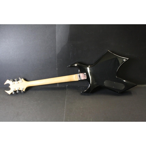 843 - Guitar - B.C. Rich Warlock Bronze Series electric guitar in black.  Various band stickers have been ... 