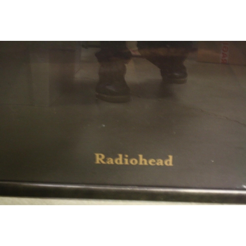 854 - Memorabilia - Two framed and glazed Radiohead posters - one band shot and one to promote the release... 