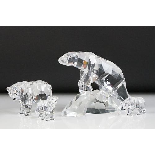 45 - Four Swarovski Crystal polar bear ornaments to include a large polar bear raised on a naturalistic b... 
