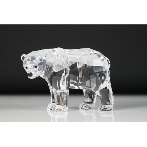 45 - Four Swarovski Crystal polar bear ornaments to include a large polar bear raised on a naturalistic b... 