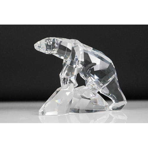 45 - Four Swarovski Crystal polar bear ornaments to include a large polar bear raised on a naturalistic b... 