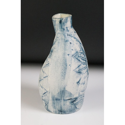 47 - Carn Pottery of Penzance, Cornwall vase of asymmetrical form, with relief tube-lined sunflower decor... 