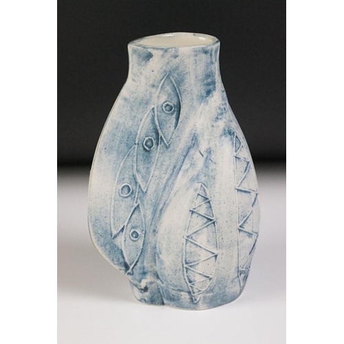 47 - Carn Pottery of Penzance, Cornwall vase of asymmetrical form, with relief tube-lined sunflower decor... 