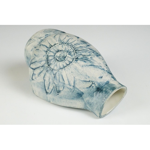 47 - Carn Pottery of Penzance, Cornwall vase of asymmetrical form, with relief tube-lined sunflower decor... 