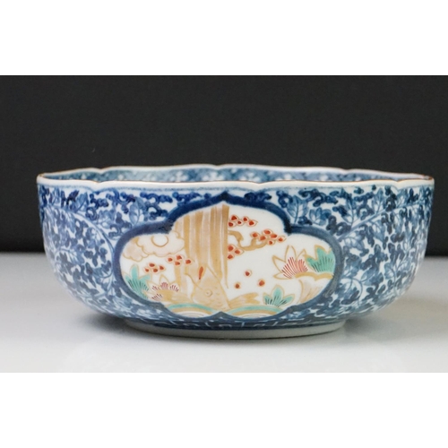 39 - 19th century Japanese Arita Ware Bowl decorated with panels of fish within a river, four character m... 