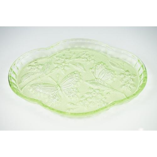 42 - Art Deco Sowerby Green Uranium Glass ' Butterfly ' Dressing Table Set comprising tray, two candlesti... 