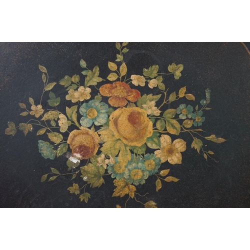 86 - Black Lacquered Papier Mache Oval Tray with shaped edge decorated with flowers, 52cm long