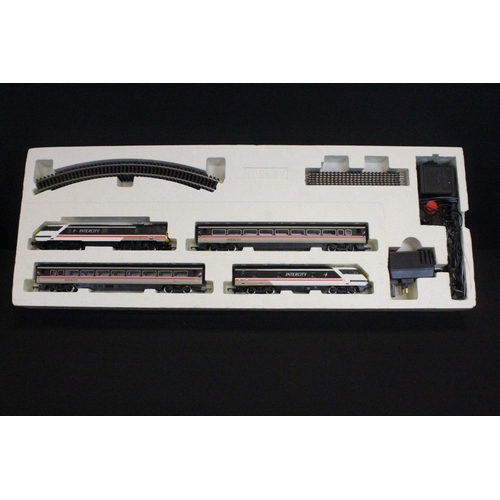 14 - Two boxed Hornby OO gauge electric train sets to include R1001 Flying Scotsman and R824 Intercity 12... 