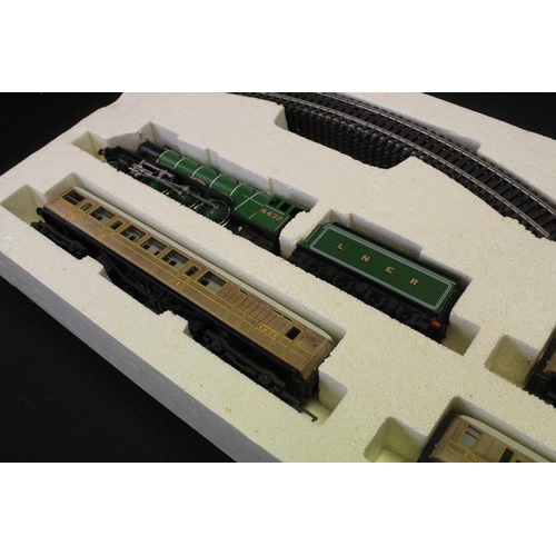 14 - Two boxed Hornby OO gauge electric train sets to include R1001 Flying Scotsman and R824 Intercity 12... 