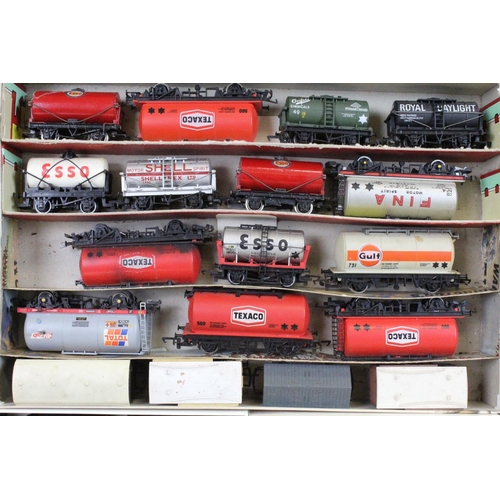 117 - Over 80 OO gauge items of rolling stock to include tankers, tender, trucks and wagons featuring Tria... 