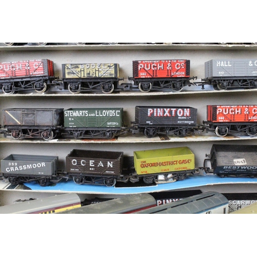 117 - Over 80 OO gauge items of rolling stock to include tankers, tender, trucks and wagons featuring Tria... 