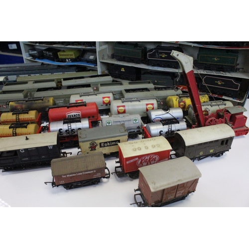 117 - Over 80 OO gauge items of rolling stock to include tankers, tender, trucks and wagons featuring Tria... 