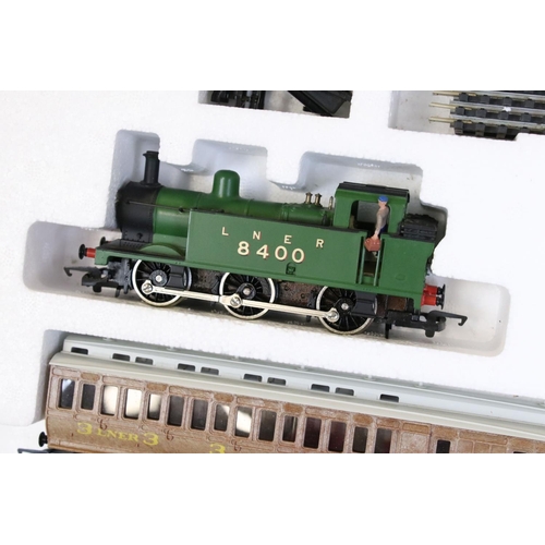 13 - Two boxed Hornby OO gauge electric train sets to include R542 Mighty Mallard and R725 Suburban Passe... 