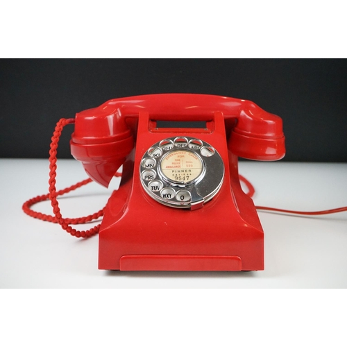 197 - Mid 20th Century Chinese Red Bakelite 300 Series desk telephone, with alphabetical dial, the handset... 