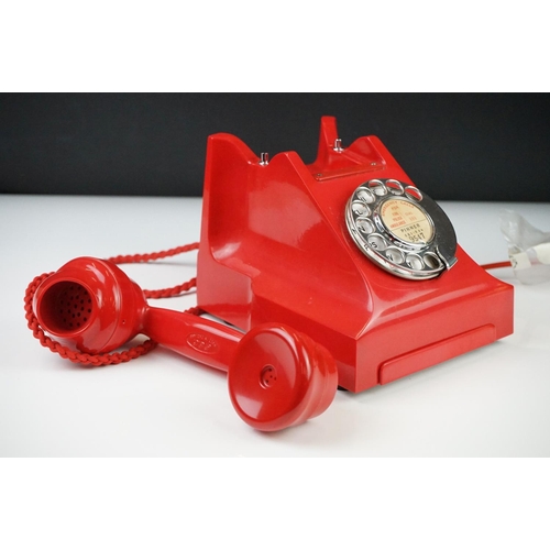 197 - Mid 20th Century Chinese Red Bakelite 300 Series desk telephone, with alphabetical dial, the handset... 