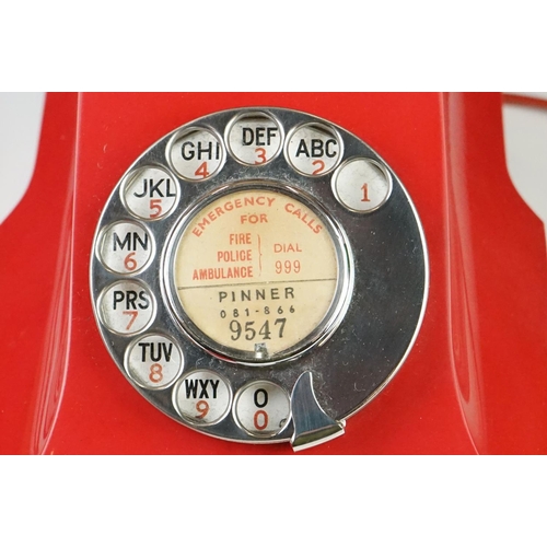 197 - Mid 20th Century Chinese Red Bakelite 300 Series desk telephone, with alphabetical dial, the handset... 