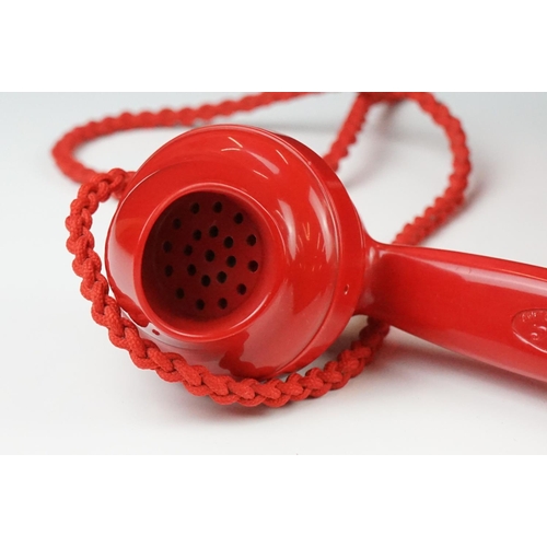 197 - Mid 20th Century Chinese Red Bakelite 300 Series desk telephone, with alphabetical dial, the handset... 