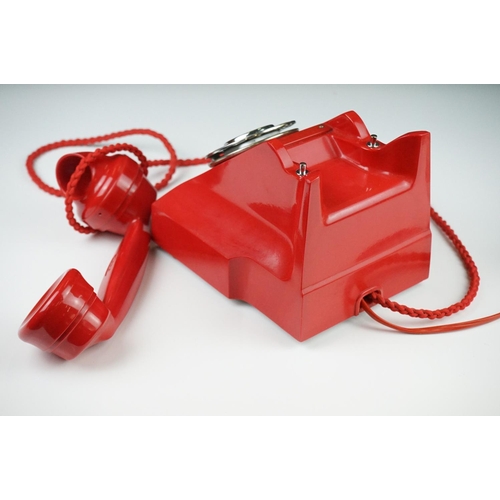 197 - Mid 20th Century Chinese Red Bakelite 300 Series desk telephone, with alphabetical dial, the handset... 