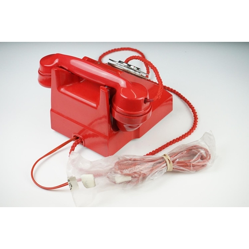 197 - Mid 20th Century Chinese Red Bakelite 300 Series desk telephone, with alphabetical dial, the handset... 