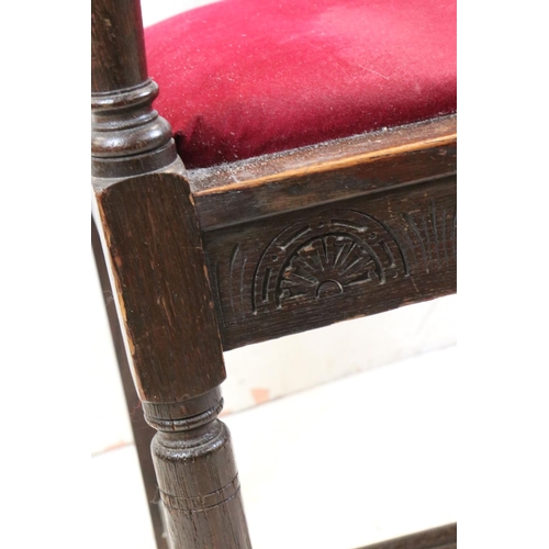 550 - In the manner of Liberty of London, Gothic Revival Oak Elbow Chair with carved back rail and upholst... 