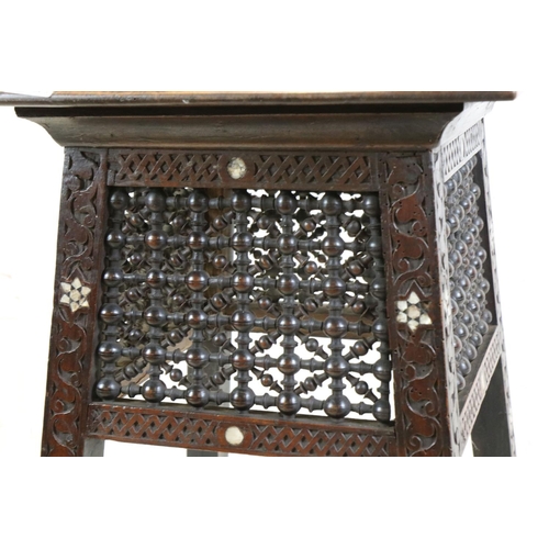 551 - In the manner of Liberty of London, Hardwood Square Table in the Moorish style with masharabiya pane... 