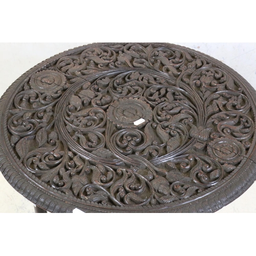 553 - Moorish Circular Hardwood Folding Table, the circular scrolling foliate top raised on a folding base... 