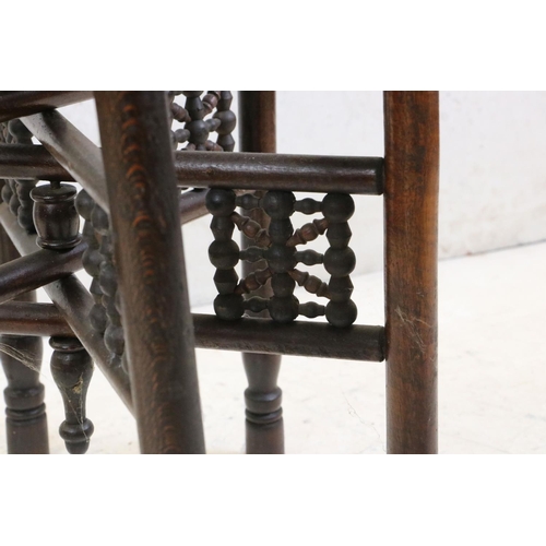 553 - Moorish Circular Hardwood Folding Table, the circular scrolling foliate top raised on a folding base... 