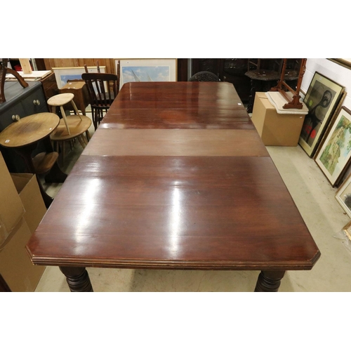 555 - Late Victorian Mahogany Wind-out Dining Table with two additional leaves raised on turned ringed and... 