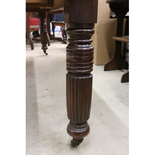 555 - Late Victorian Mahogany Wind-out Dining Table with two additional leaves raised on turned ringed and... 