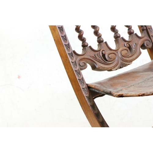 574 - Moorish Hardwood Carved Folding Chair with embossed leather seat, 84cm high x 37xm wide