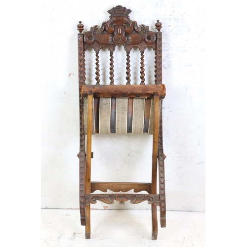 574 - Moorish Hardwood Carved Folding Chair with embossed leather seat, 84cm high x 37xm wide