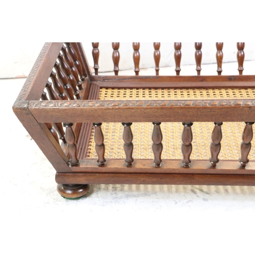 589 - Early 20th century Walnut Doll's Cot or Dog Bed with bergere cane base, 70cm long x 20cm high