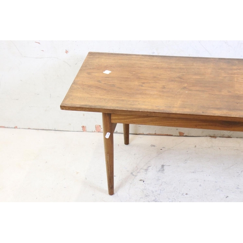 591 - Mid century Retro Teak Long Rectangular Coffee Table raised on turned legs, 122cm long x 41cm high