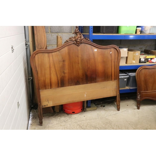 602 - French Walnut Carved Double Bed Frame, the shaped headboard centred with carved foliate scrolling