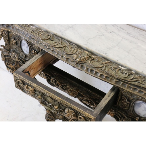 605 - Marble Top Console Table, the wooden frame with a plaster scrolling gilt finish, 75cm wide x 79cm hi... 