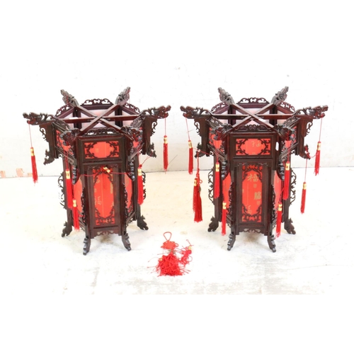 613 - Pair of Chinese Wood Dragon Palace Lanterns with red paper panels and red tassels, 45cm high